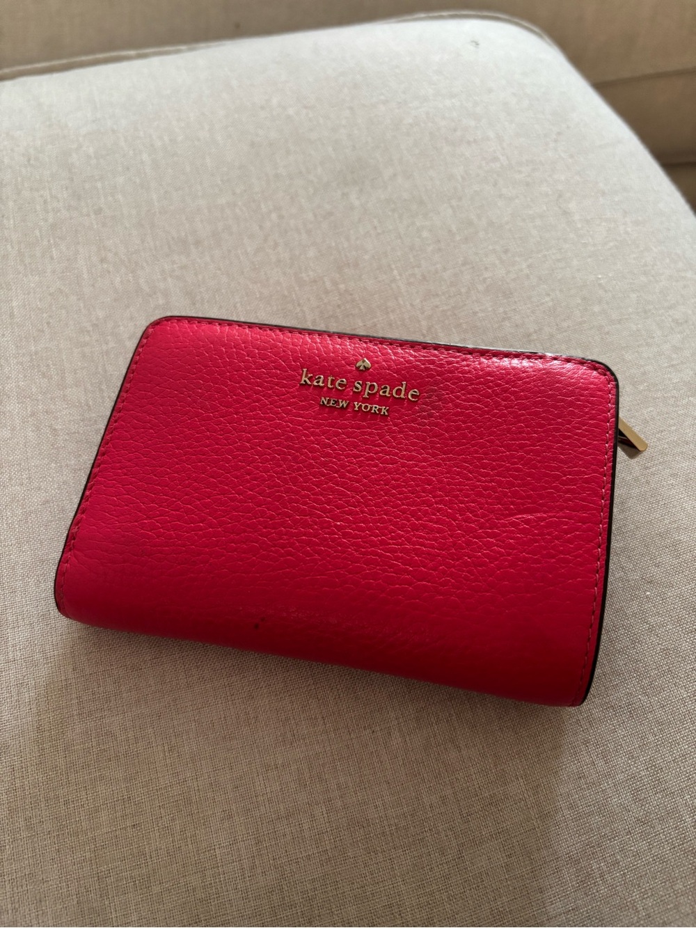 kate spade New York pebbled hot pink zip-around wallet